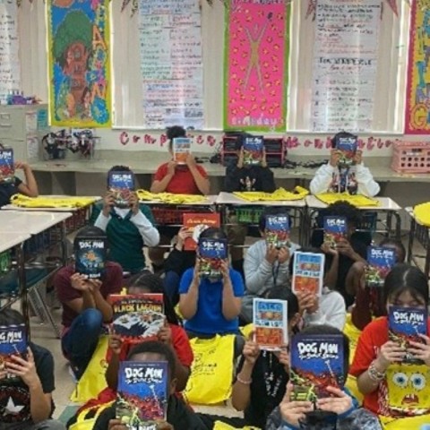 Children at Barton Elementary School hold up books they chose as part of Leadership Palm Beach County's 2025 Education Day reading event.